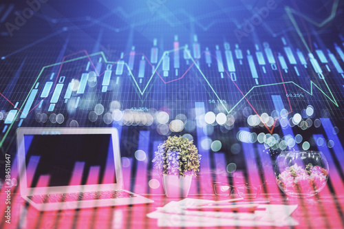 Financial market graph hologram and personal computer on background. Double exposure. Concept of forex.