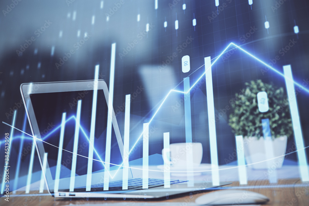 Forex graph hologram on table with computer background. Multi exposure. Concept of financial markets. Forex graph hologram on table with computer background. Multi exposure. Concept of financial markets.