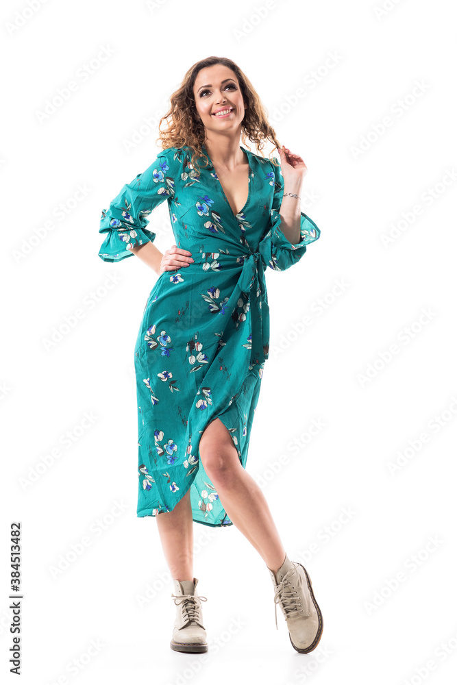Playful happy young woman in dress smiling and having idea. Full body portrait isolated on white background Playful happy young woman in dress smiling and having idea. Full body portrait isolated on white background