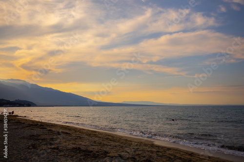 warm sunny cloudy sunset on the beach