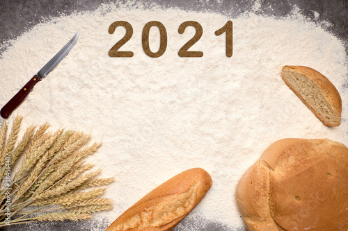 Happy New Year 2021. Symbol from number 2021 on flour to make bread