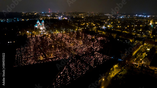 Cemetery at All Saints night, aerial view. Cemetery at November 1st decorated with millions of candles burning. European All Saints Day and All Souls' Day in Poland, Katowice. Halloween. photo