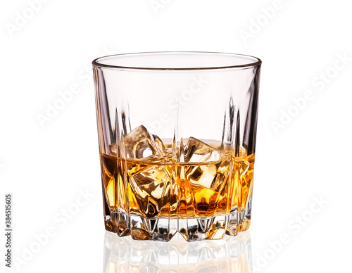 Tela Crystal glass of whiskey with ice cubes isolated on white.