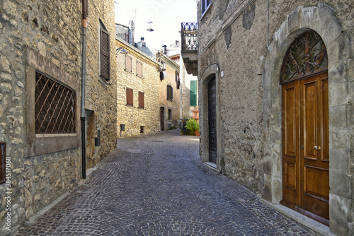Fototapeta Naklejka Na Ścianę i Meble -  A narrow street between the old houses of the town of Vico nel Lazio, in the province of Frosinone