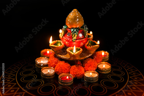 Indian Festival Diwali , oil lamp and flower design on dark background