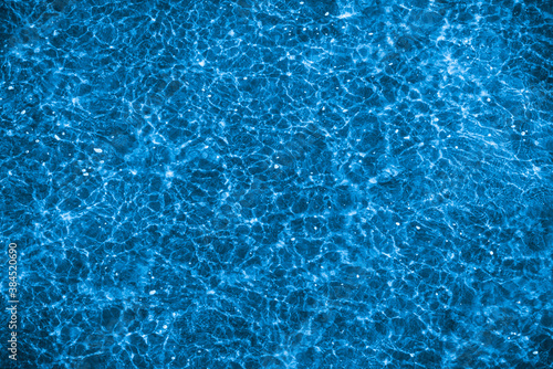 Shallow ripple on the surface of the sea water - beautiful water blue background