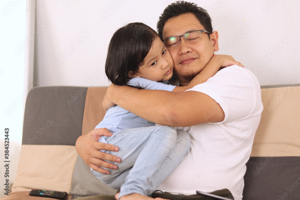 Asian father smiling while playing with his baby girl, dad and daughter love each other, happy single parent Asian father smiling while playing with his baby girl, dad and daughter love each other, happy single parent