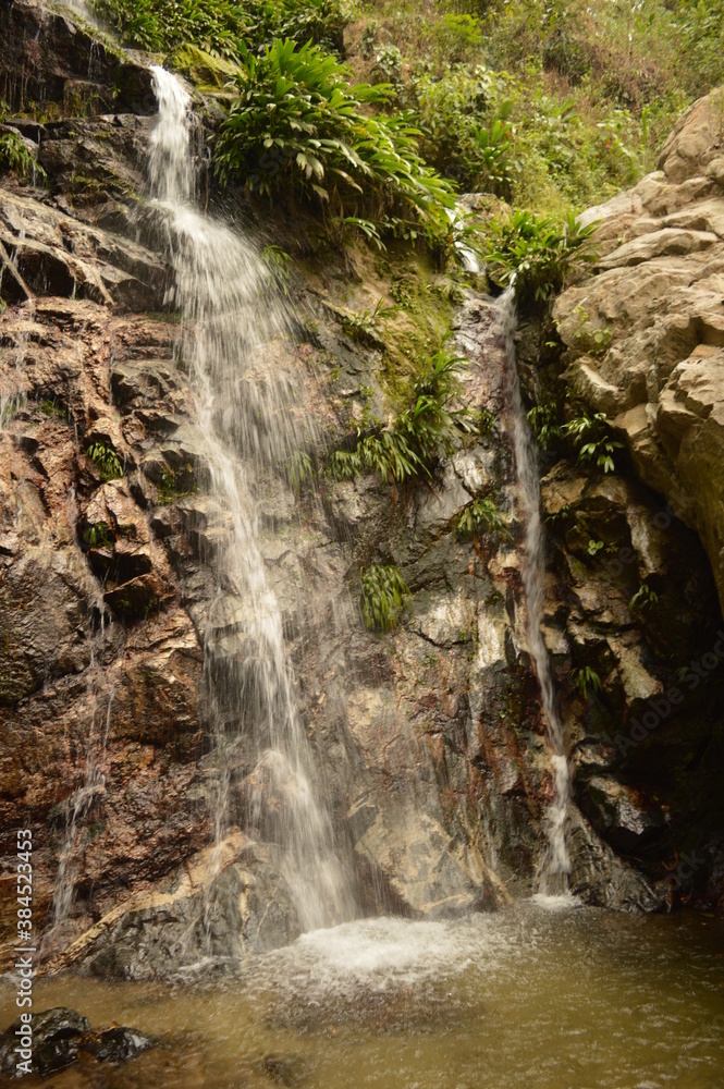 Obraz premium The stunning beaches and mountains of Parque Nacional Natural Tayrona in Santa Marta region of Colombia