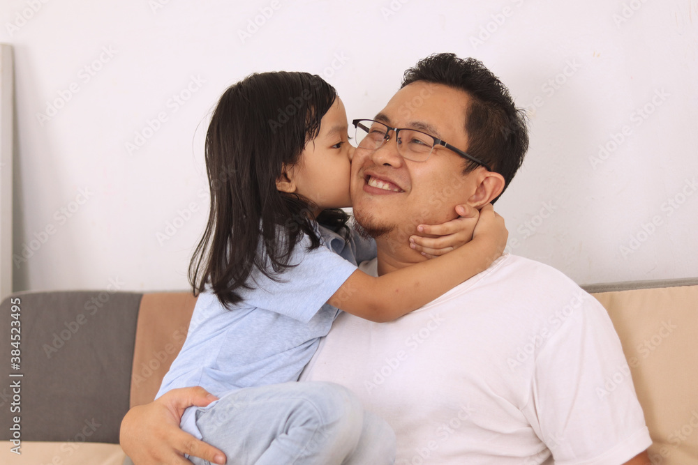 Asian father smiling while playing with his baby girl, dad and daughter love each other, happy single parent Asian father smiling while playing with his baby girl, dad and daughter love each other, happy single parent