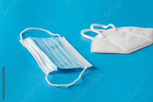 Different type face mask on blue background.