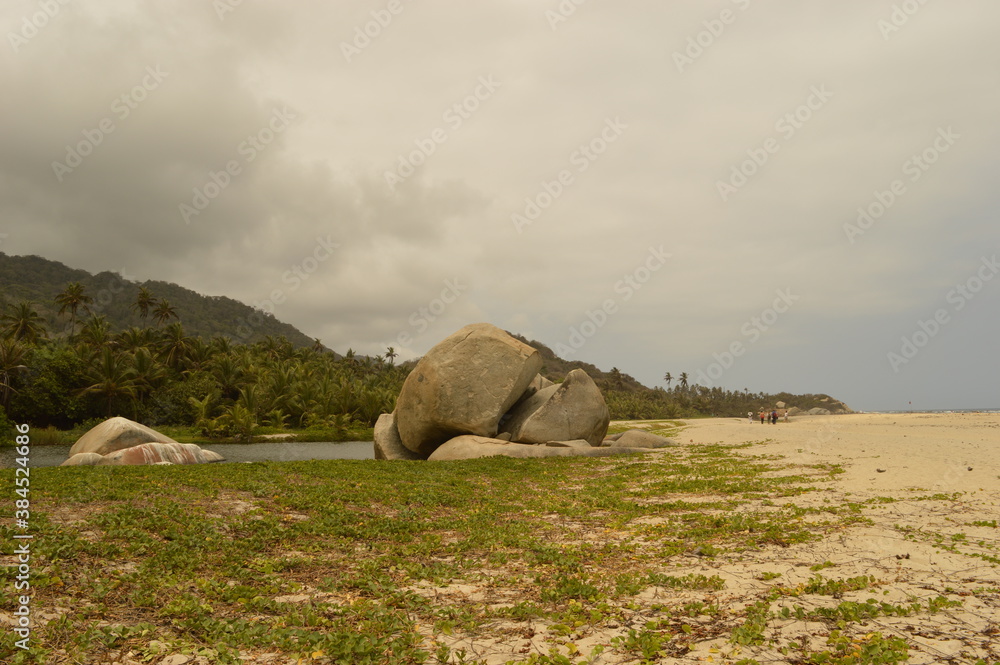 Naklejka premium The stunning beaches and mountains of Parque Nacional Natural Tayrona in Santa Marta region of Colombia