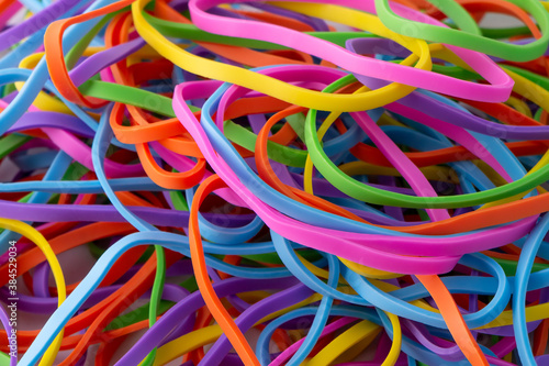 Neon multi colour rainbow rubber bands background texture