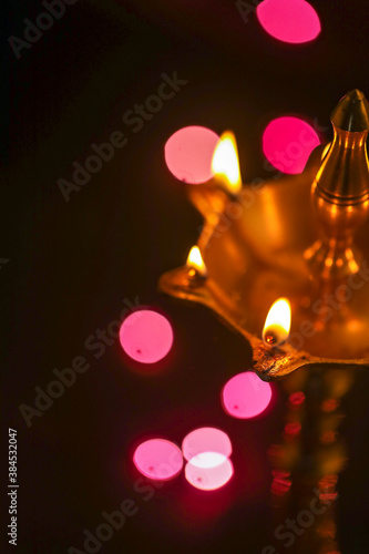 Colorful clay diya lamps lit during diwali celebration