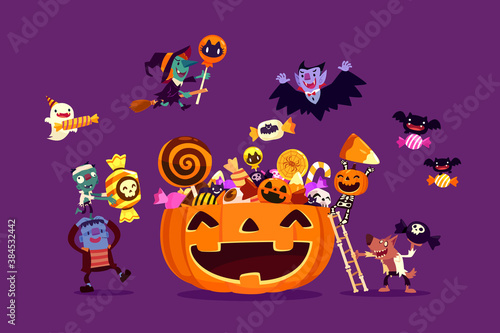 halloween monsters filling carved pumpkin with candies and sweets
