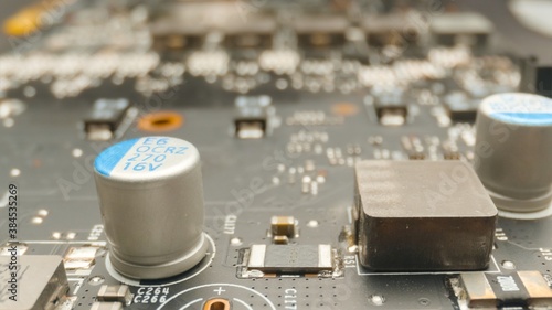 Motherboard close up photo with transistors photo