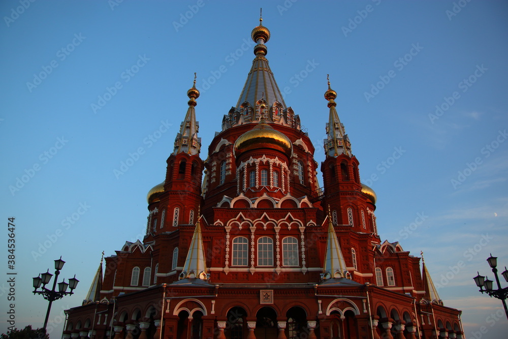 red brick orthodox cathedral at sunset