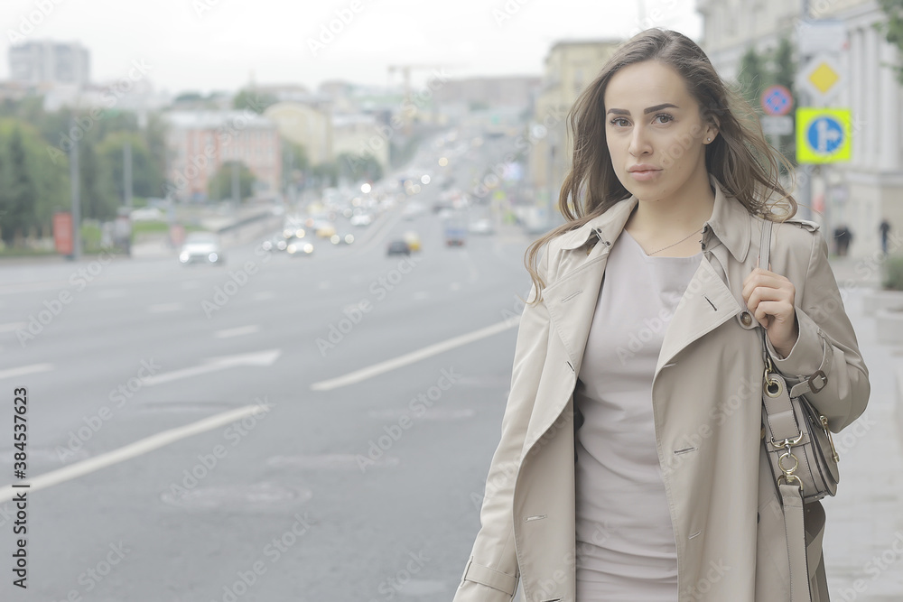 business lady stands road, cars, traffic, urban style, travel in the city, woman and cars business lady stands road, cars, traffic, urban style, travel in the city, woman and cars