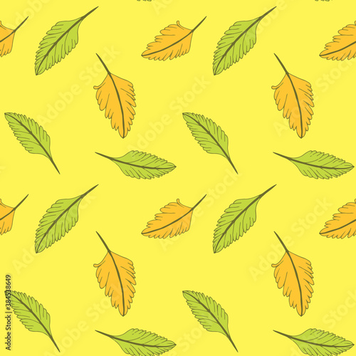 Autumn leave. Seamless pattern in warm autumn colors. Leaves on a yellow background.