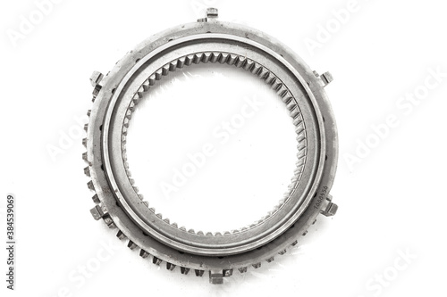 Gear on a white isolated background in a photo studio. Detail of a car engine for repair or sale in a auto service or workshop.