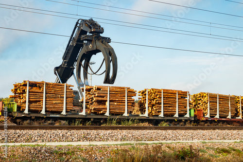 Kouvola, Finland - 24 September 2020: Unloading of timber from railway carriages at paper mill Stora Enso photo