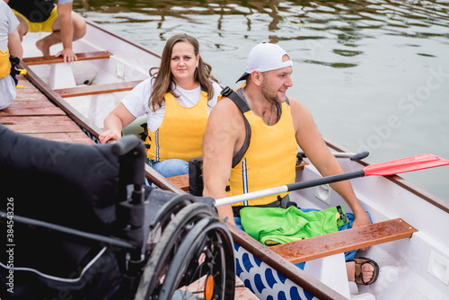 People with disabilities sail on a rowing boat.