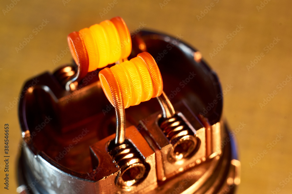 Vape RDA or e-cigarette for vaping with coils and cotton, rebuildable dripping atomizer or vaporizer. Vape RDA or e-cigarette for vaping with coils and cotton, rebuildable dripping atomizer or vaporizer.