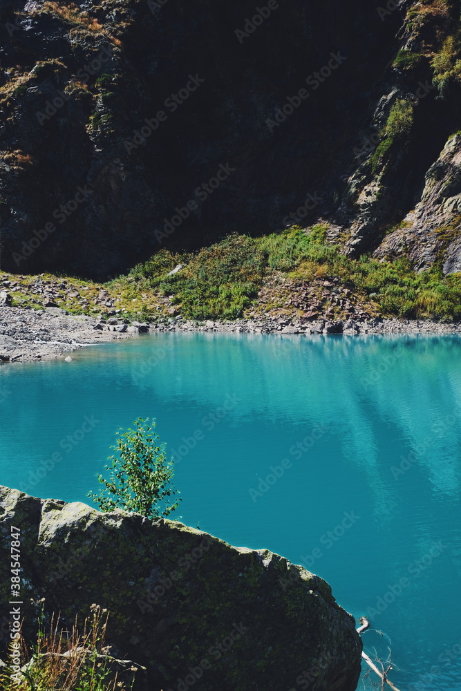 view of the lake in the mountains. pure blue color of water