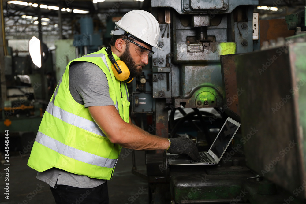 A engineer or technician or worker working with blue print drawing spec about machine part preparing or operate or repair maintenance in factory A engineer or technician or worker working with blue print drawing spec about machine part preparing or operate or repair maintenance in factory