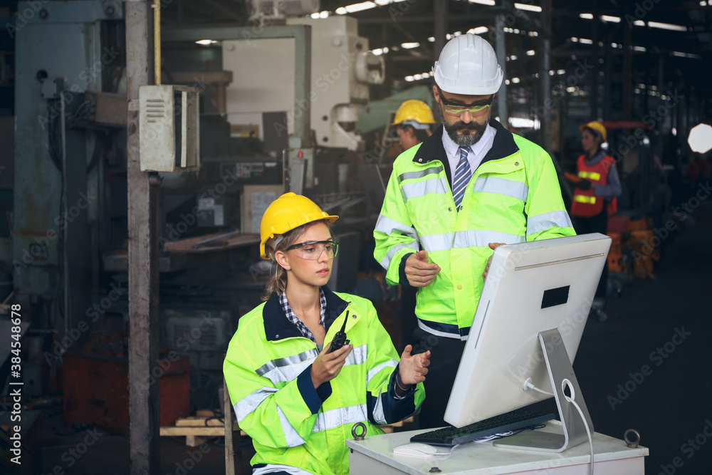 Engineer team inspect or checking the machine in workshop factory, the technician control for repair or maintenance part or equipment by radio and computer Engineer team inspect or checking the machine in workshop factory, the technician control for repair or maintenance part or equipment by radio and computer