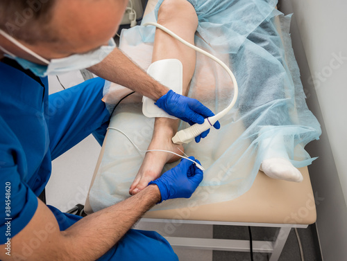 Cardiologist use tubes and ultrasound for radiofrequency catheter ablation.