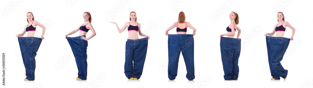 Woman with large jeans in dieting concept Woman with large jeans in dieting concept