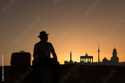 man in front of berlin city skyline in germany