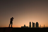 man in front of sacramento city skyline