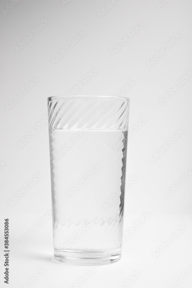 Water in a glass transparent glass on a white background Water in a glass transparent glass on a white background