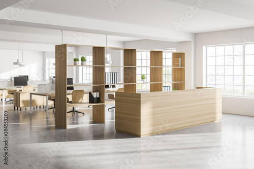 Modern white open space office corner with wooden tables and reception