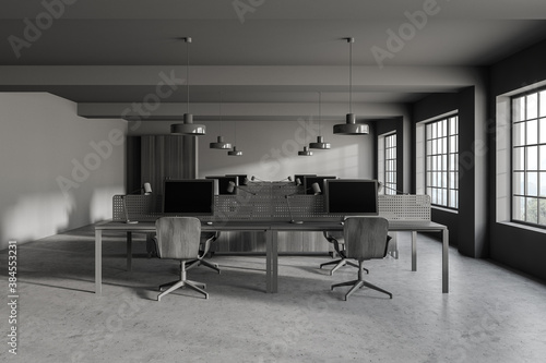 Modern gray open space office with wooden tables