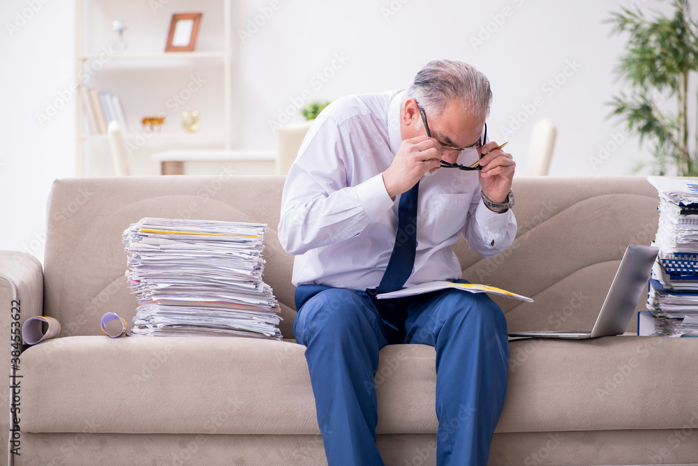 Aged businessman employee working from house Aged businessman employee working from house