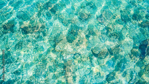 sea water transparent turquoise surface top view from above photo