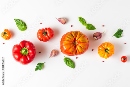 Fototapeta Naklejka Na Ścianę i Meble -  Organic vegetables composition. Tomato, basil, spices, pepper, garlic on white background. top view. flat lay. Vegan food