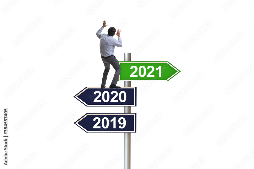 Road sign and businessman with 2020 and 2021 Road sign and businessman with 2020 and 2021