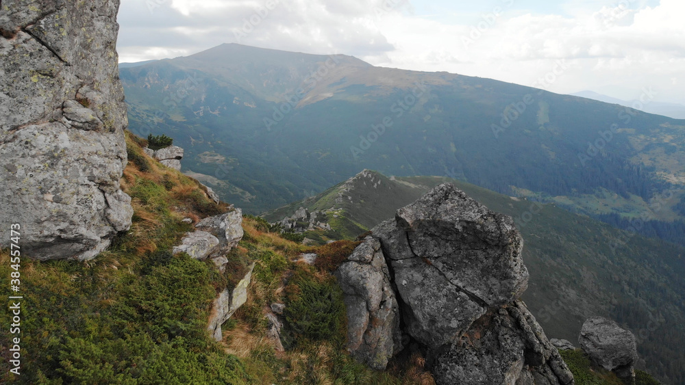 Huge stone boulder. Lovely mountain landscape. Huge stone boulder. Lovely mountain landscape.