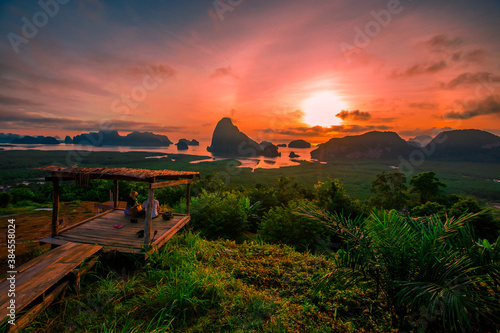 The natural background of the morning light rising in the middle of the sea and surrounded by mountains  cool breezes  the beauty of the ecology of the tourist attractions.