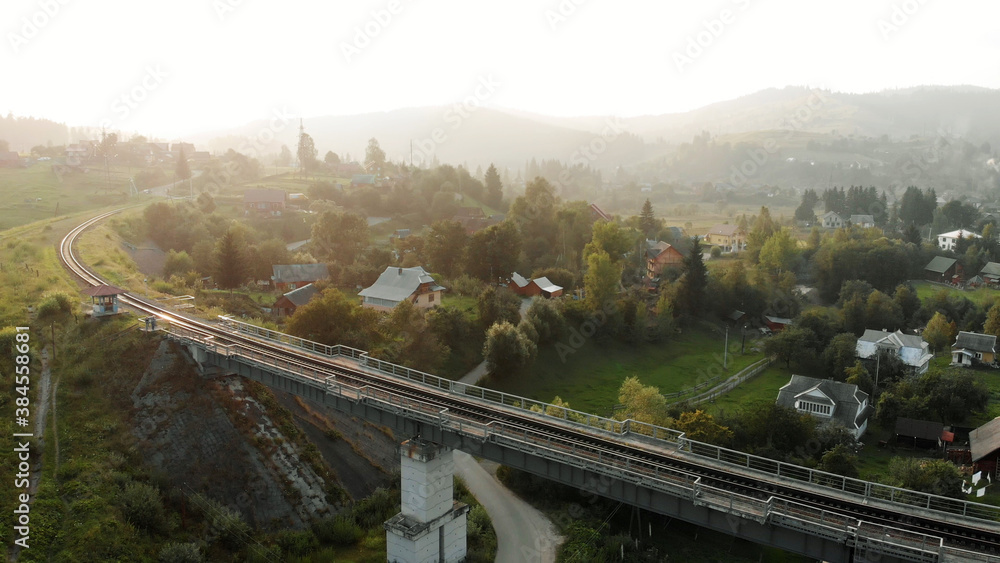 Topview of railway bridge. Amazing village in mountains. Topview of railway bridge. Amazing village in mountains.
