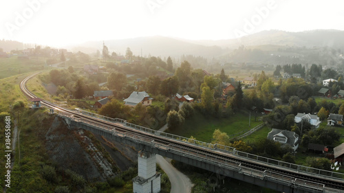 Topview of railway bridge. Amazing village in mountains.