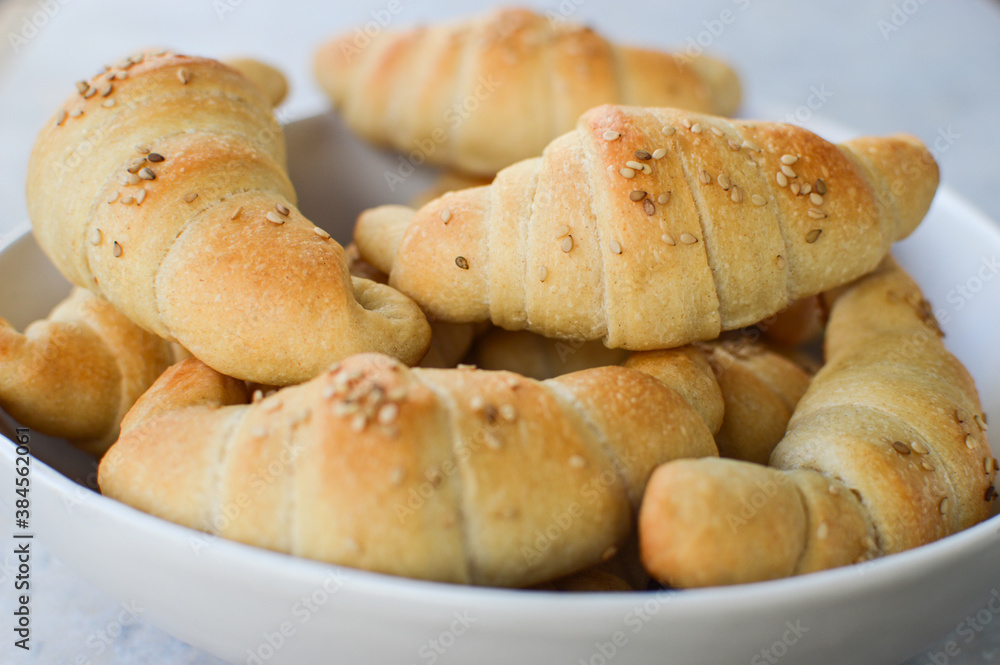Traditional Serbian homemade rolls(kiflice) in the white bowl, close up