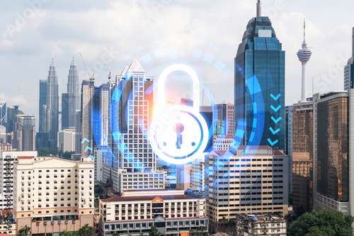Canvas Print Padlock icon hologram over panorama city view of Kuala Lumpur to protect business, Malaysia, Asia