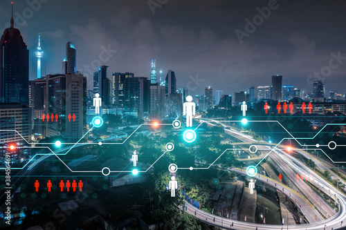 Canvas Print Glowing Social media icons on night panoramic city view of Kuala Lumpur, Malaysia, Asia