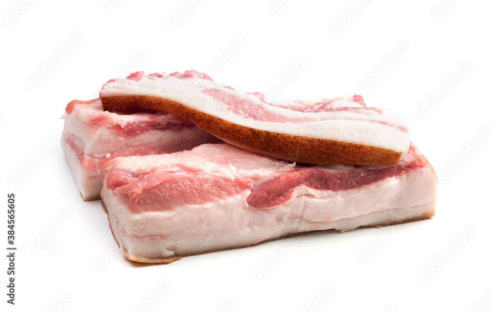 Two large lard pieces and a thin tenderloin isolated on a white background. Butcher shop. The concept of fresh, natural products. Two large lard pieces and a thin tenderloin isolated on a white background. Butcher shop. The concept of fresh, natural products.