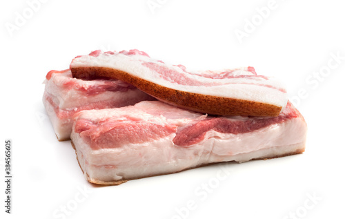 Two large lard pieces and a thin tenderloin isolated on a white background. Butcher shop. The concept of fresh, natural products.