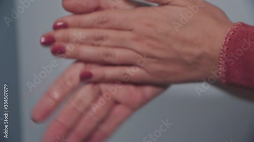 woman washing hands with hydroalcoholic gel 03 photo